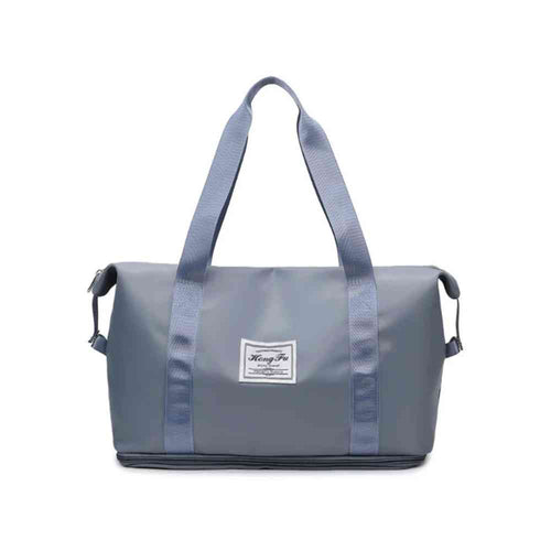 Bolsa de Academia e Viagem Feminina Leve Expansível Azul Petróleo Urbanno, vista frontal, com design espaçoso e etiqueta da marca na frente, ideal para praticidade no dia a dia e viagens.