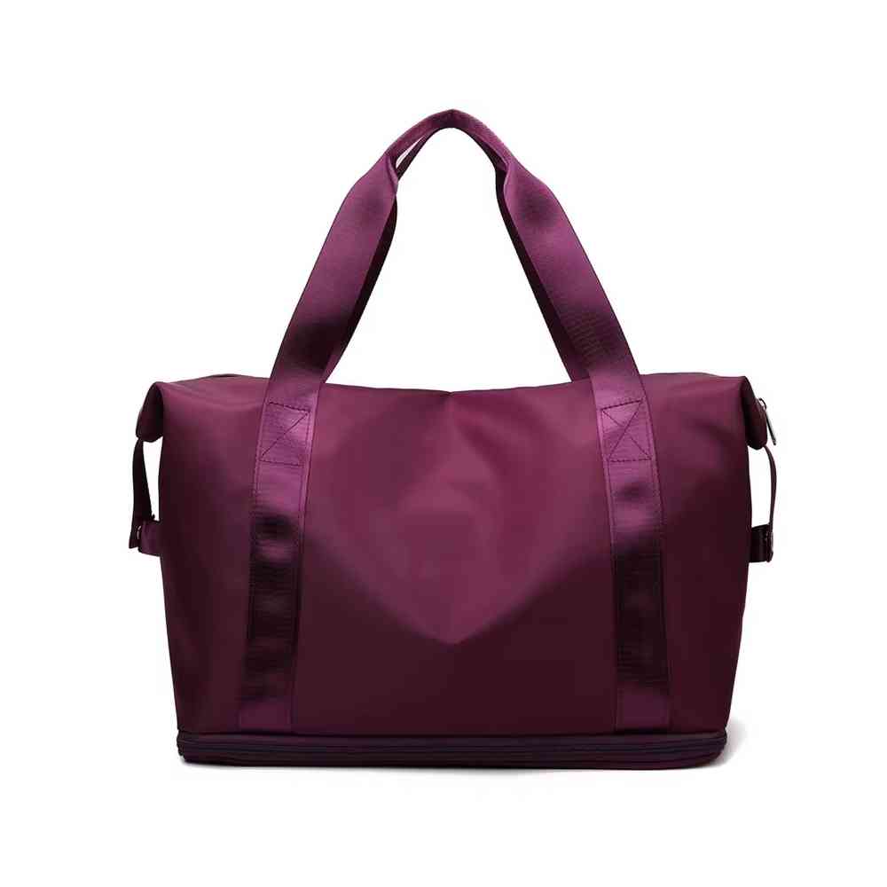 Bolsa de Academia e Viagem Feminina Leve Expansível Vinho Urbanno, vista frontal em seu estado compacto, com alças duplas e etiqueta da marca, pronta para ser expandida e usada.