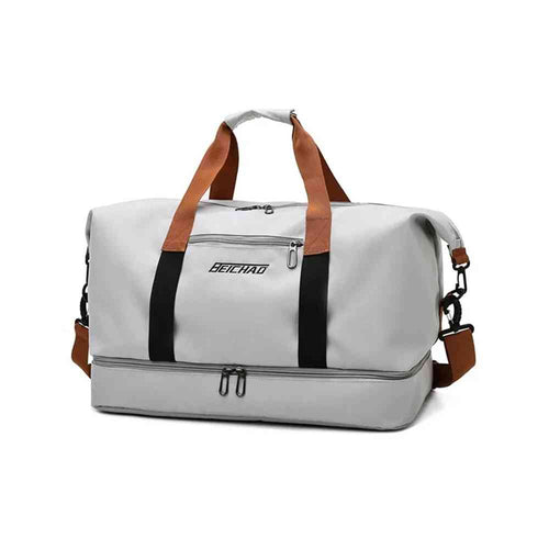 Bolsa de Academia e Viagem Grande com Compartimento de Sapatos Cinza Urbanno, vista frontal, exibindo alças de mão marrons e alça de ombro, e compartimento inferior com zíperes duplos.