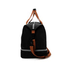 Bolsa de Academia e Viagem Grande com Compartimento de Sapatos Preta Urbanno, vista lateral, destacando as alças marrons e o design compacto, ideal para viagens.