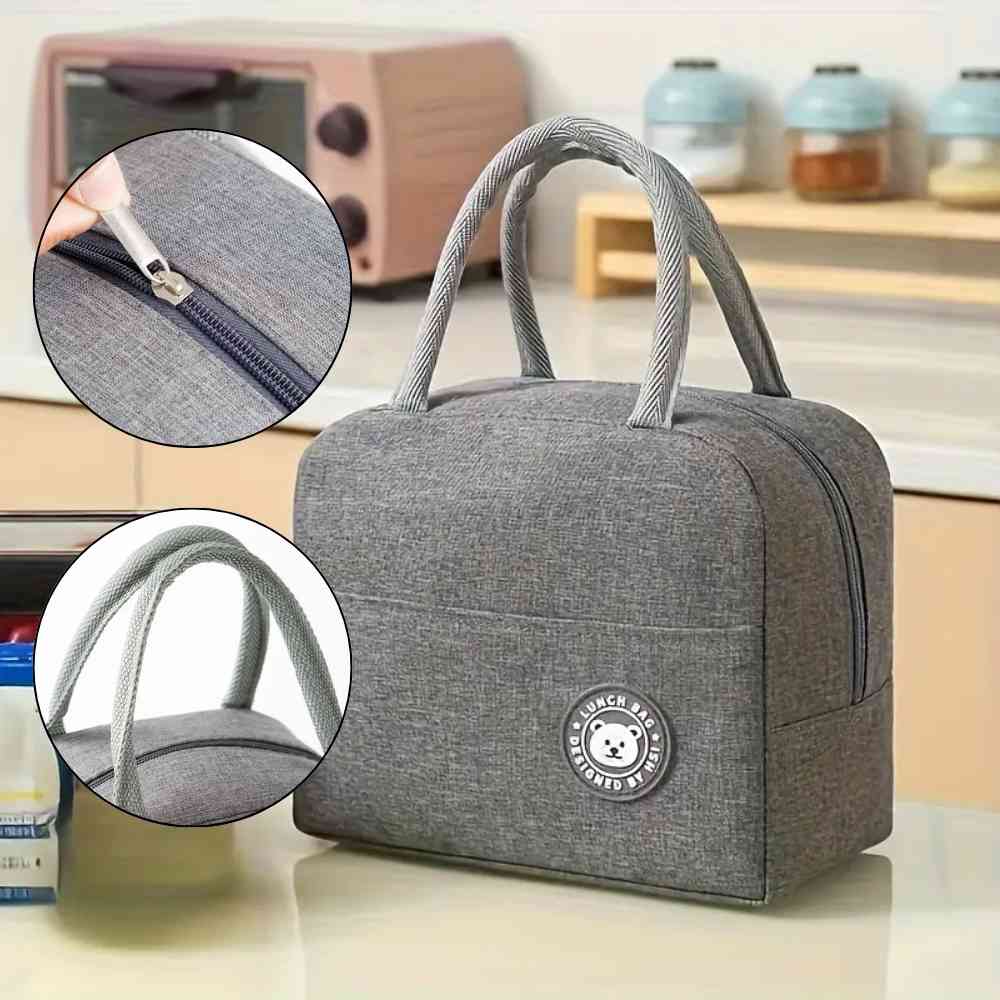 Bolsa Térmica para Marmitas e Dietas Urbanno cinza, destacando detalhe do zíper suave e as alças superiores para transporte