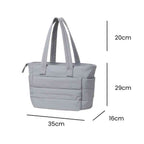 Bolsa Tote de Academia e Dia a Dia Feminina Acolchoada Urbanno cinza, exibindo suas dimensões de 49cm de altura (29cm corpo + 20cm alça), 35cm de comprimento e 16cm de largura